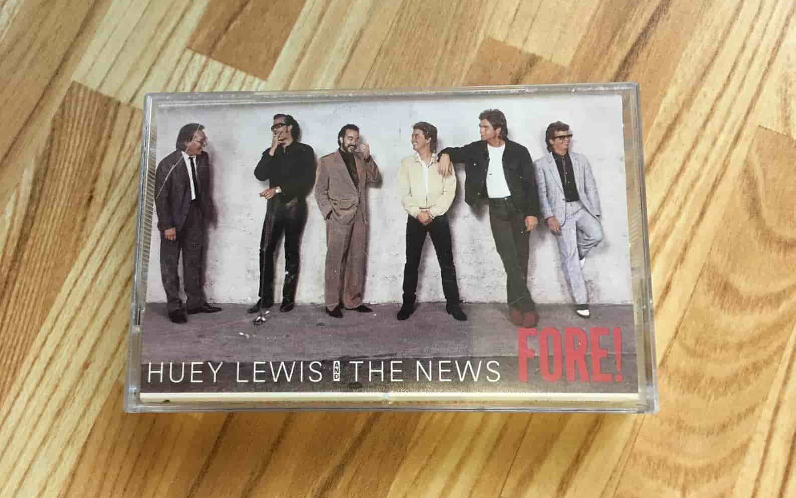 Audio cassette case for the album Fore! by Huey Lewis and The News