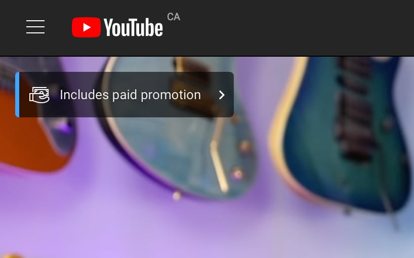 Screenshot of YouTube video with banner that reads "Includes paid promotion" with an icon of a hand holding money.