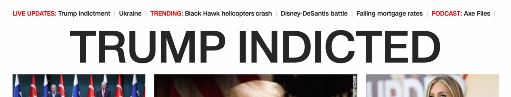 Partial screenshot of CNN.com website with the headline "TRUMP INDICTED"