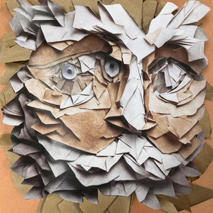 Abstract art with faces made from cut-out paper.